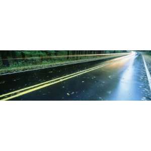 Traffic Moving on the Wet Road through a Forest, Leland, Michigan, USA 