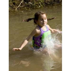 Year Old Girl Jumping into a Pond, Woodstock, New York, USA 