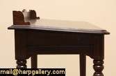 Carved of solid quarter sawn oak about 1870, this slant top desk is 