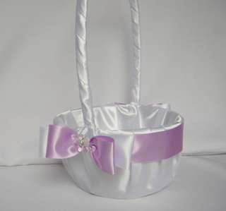 THIS WHITE SATIN GUEST BOOK IS ADORNED WITH LILAC AND WHITE SATIN BOWS 