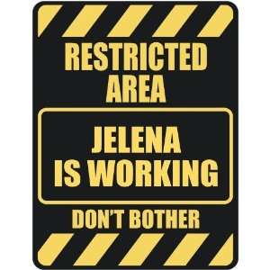   RESTRICTED AREA JELENA IS WORKING  PARKING SIGN