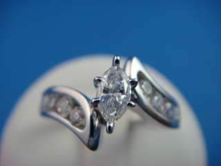   MARQUISE & ROUND CHANNEL SET DIAMONDS ENGAGEMENT RING 0.85 CT. T.W