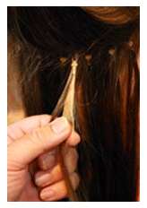 Hold the hair extension metal ring with one hand, and remove the 