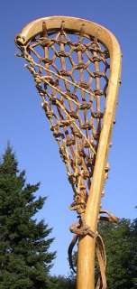 is a vintage wooden lacrosse stick. Measures 46 long. The lacrosse 
