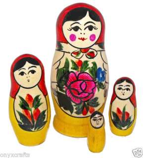 Set of five nesting dolls was carved of bolsa wood and hand painted in 